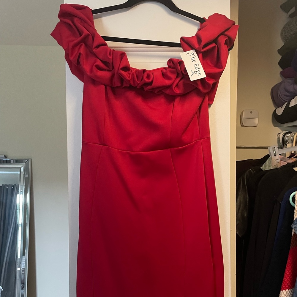 Brand new red dress with tag. Size large. Small slit in front of dress.